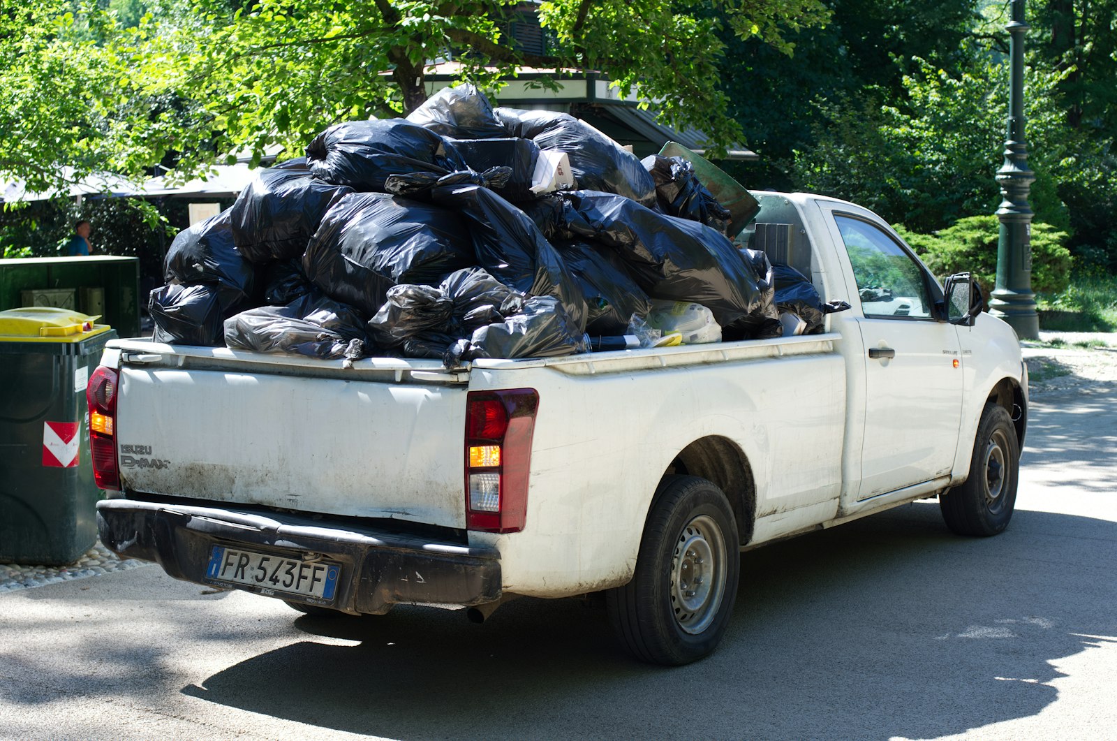 Rubbish removal truck being loaded